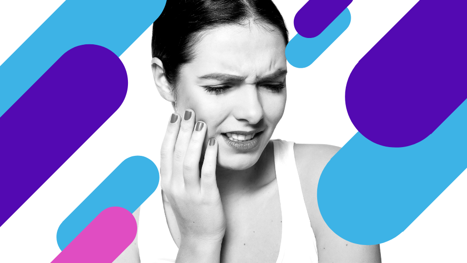woman holding jaw teeth pain